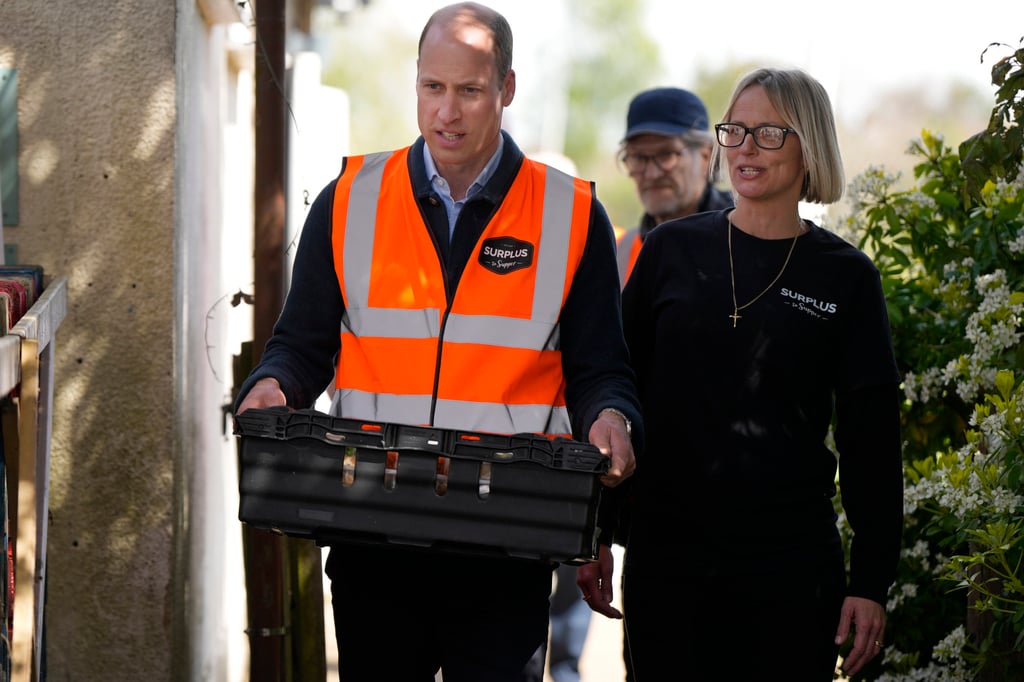 Britain’s Prince William carries a tray of food with Claire Hopkins, Operations Director, during a visit to Surplus to Supper, in Surrey, England on Thursday. Photo: AP/Pool Britain’s Prince William carries a tray of food with Claire Hopkins, Operations Director, during a visit to Surplus to Supper, in Surrey, England on Thursday. Photo: AP/Pool