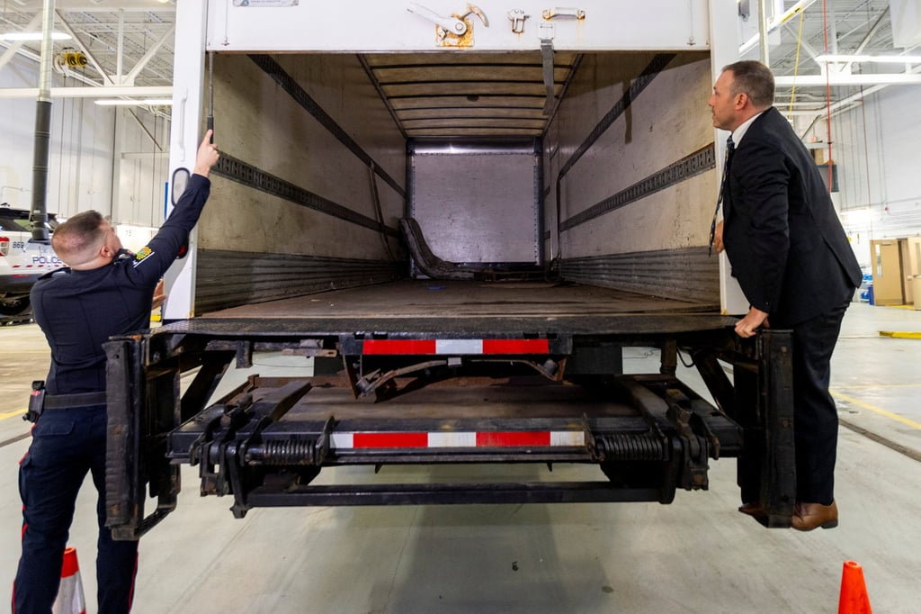Police officers open the back of the truck used in the heist at a news conference in Brampton, Ontario, Canada on Wednesday. Photo: Reuters Police officers open the back of the truck used in the heist at a news conference in Brampton, Ontario, Canada on Wednesday. Photo: Reuters