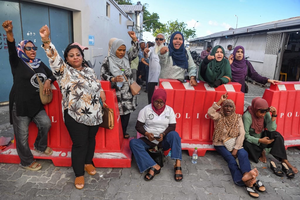 Supporters of former Maldives president Abdulla Yameen outside the High Court in Male, Maldives on Thursday. Photo: AFP Supporters of former Maldives president Abdulla Yameen outside the High Court in Male, Maldives on Thursday. Photo: AFP