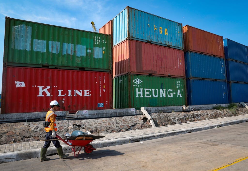 A worker pushes a wheelbarrow near shipping containers at Sunda Kelapa port in Jakarta on Tuesday. China is Indonesia’s biggest trade partner, as trade volume between the two countries last year reached US$127 billion. Photo: EPA-EFE A worker pushes a wheelbarrow near shipping containers at Sunda Kelapa port in Jakarta on Tuesday. China is Indonesia’s biggest trade partner, as trade volume between the two countries last year reached US$127 billion. Photo: EPA-EFE