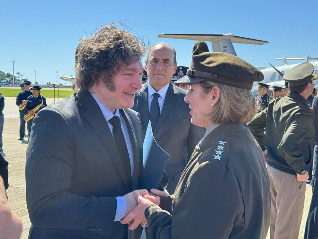 Argentina’s President Javier Milei shakes hands with Commander of the United States Southern Command, General Laura Richardson. Photo: Argentine Presidency via Reuters