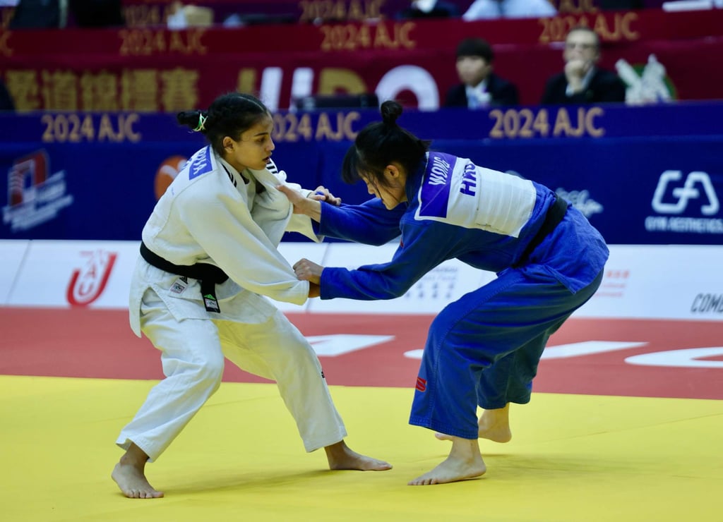 Wong Ka-lee (right) and Kurbanay Kurbanova clash at the Asian Judo Championships. Photo: Mike Chan