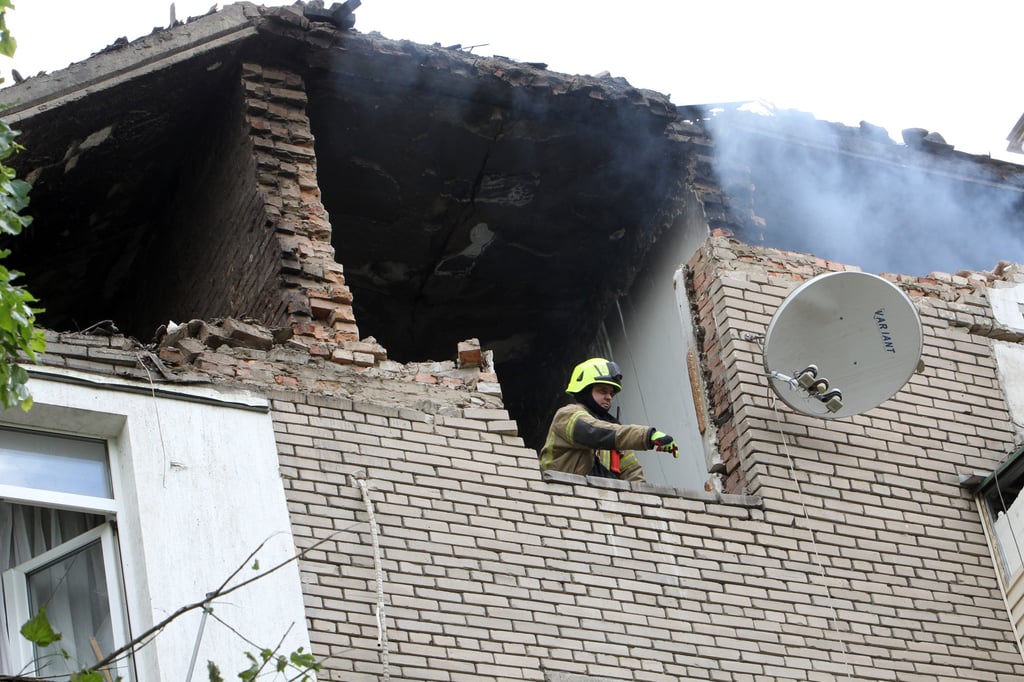 A rescuer is seen at work at an apartment block that was partially destroyed by the Russian missile attack on Dnipro on Friday. Photo: Ukrinform via dpa A rescuer is seen at work at an apartment block that was partially destroyed by the Russian missile attack on Dnipro on Friday. Photo: Ukrinform via dpa