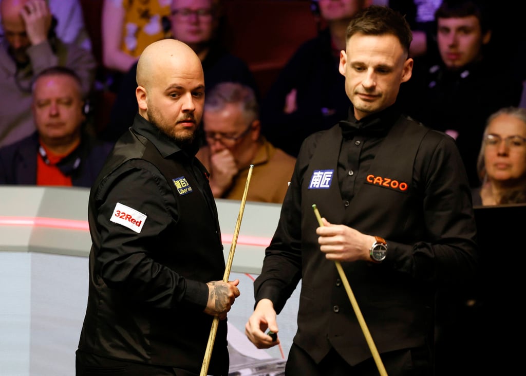 Luca Brecel (left) and opponent David Gilbert. Photo: AP Luca Brecel (left) and opponent David Gilbert. Photo: AP