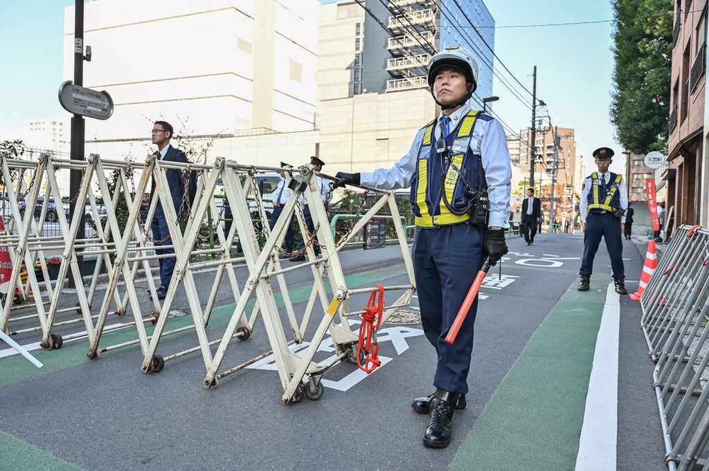 Japanese police on duty in Tokyo. Police say bookstores carrying the title, as well as the newspaper, have received threats. Sankei has filed a complaint on the grounds of obstruction of business. Photo: AFP Japanese police on duty in Tokyo. Police say bookstores carrying the title, as well as the newspaper, have received threats. Sankei has filed a complaint on the grounds of obstruction of business. Photo: AFP
