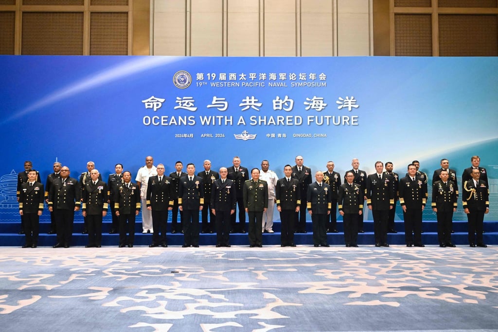 Delegates pose for a group photo before the opening ceremony of the 19th Western Pacific Naval Symposium in Qingdao on Monday. Photo: AFP Delegates pose for a group photo before the opening ceremony of the 19th Western Pacific Naval Symposium in Qingdao on Monday. Photo: AFP
