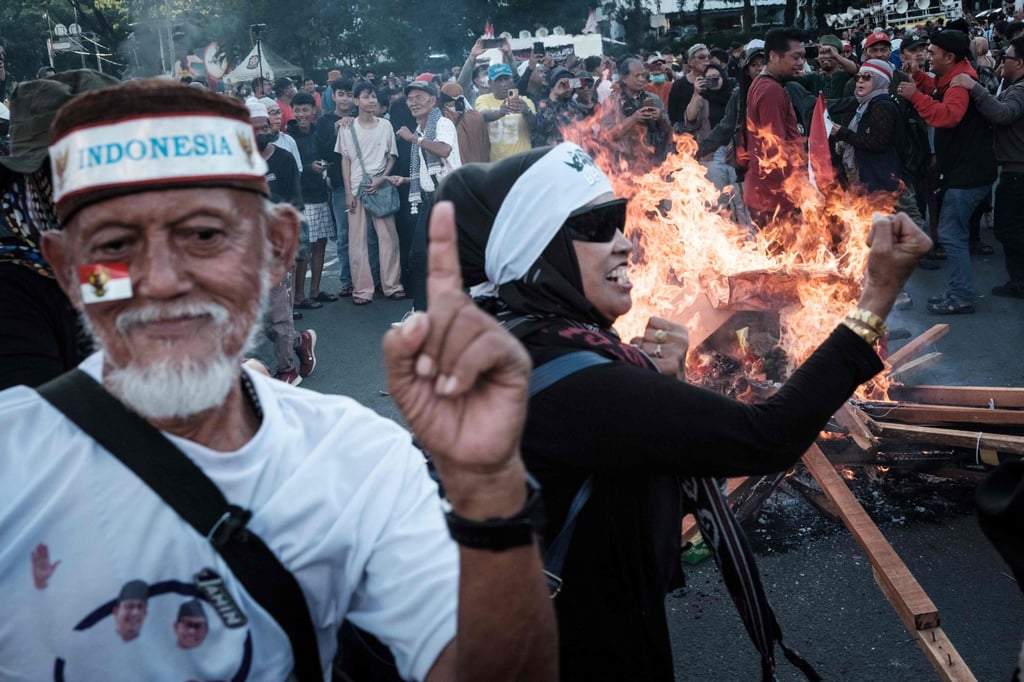 Demonstrators react during a protest against the results of the recent presidential election as the Constitutional Court ruled on the petitions of former candidates in Jakarta on April 22. Photo: AFP