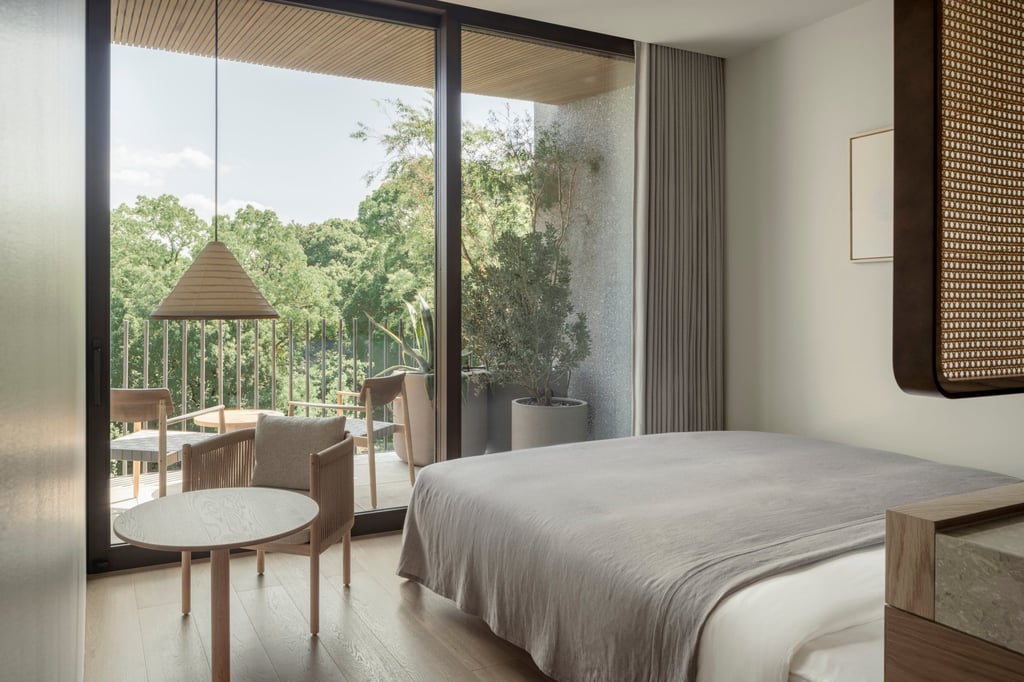A bedroom at Trunk (Hotel) Yoyogi Park in Tokyo overlooking the park. Photo: Tomooki Kengaku A bedroom at Trunk (Hotel) Yoyogi Park in Tokyo overlooking the park. Photo: Tomooki Kengaku