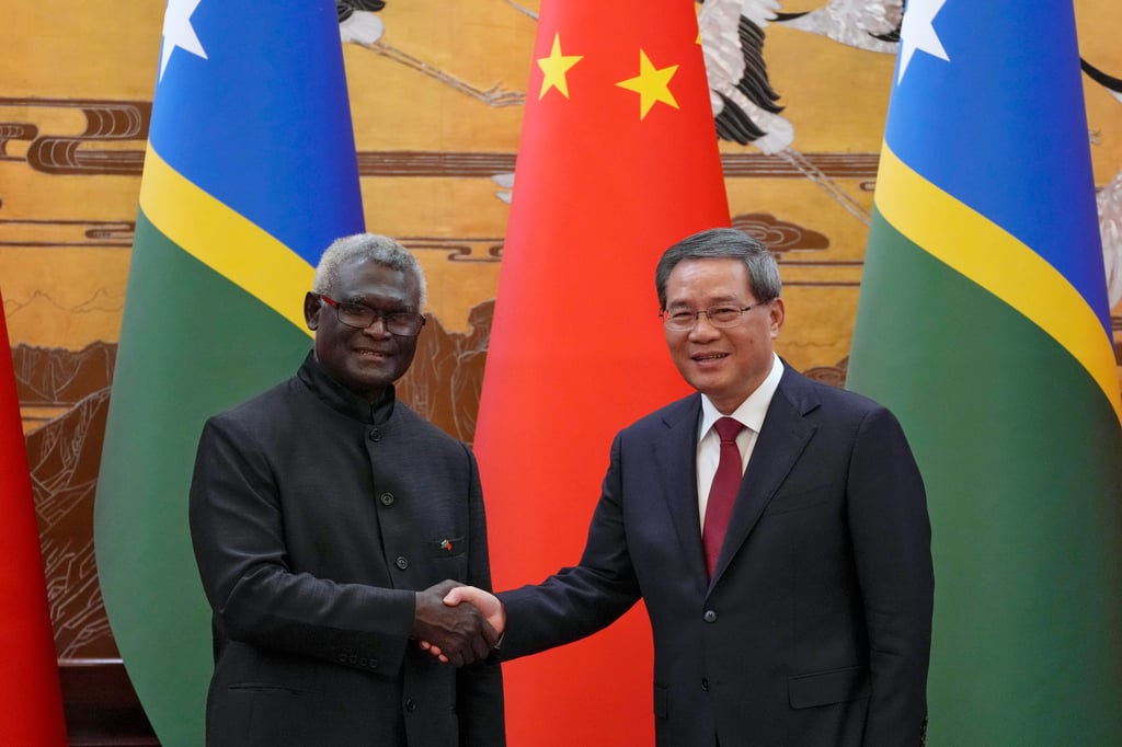 Solomon Islands Prime Minister Manasseh Sogavare (left) and his Chinese counterpart Li Qiang. Sogavare signed a security pact with Beijing in 2022, and has overseen the rapid expansion of Chinese interests across the archipelago. Photo: AP Solomon Islands Prime Minister Manasseh Sogavare (left) and his Chinese counterpart Li Qiang. Sogavare signed a security pact with Beijing in 2022, and has overseen the rapid expansion of Chinese interests across the archipelago. Photo: AP