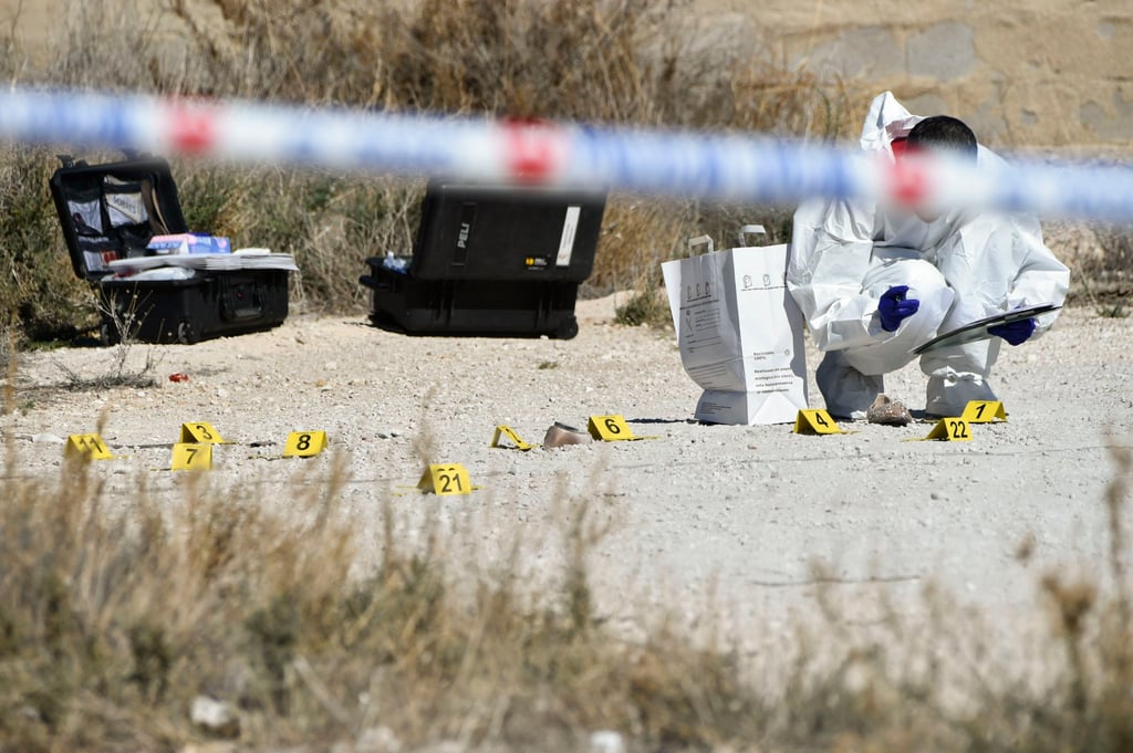 A Spanish Civil Guard officer gathers evidence from a crime scene where the body of a Singaporean woman on April 10. Photo: EPA-EFE A Spanish Civil Guard officer gathers evidence from a crime scene where the body of a Singaporean woman on April 10. Photo: EPA-EFE