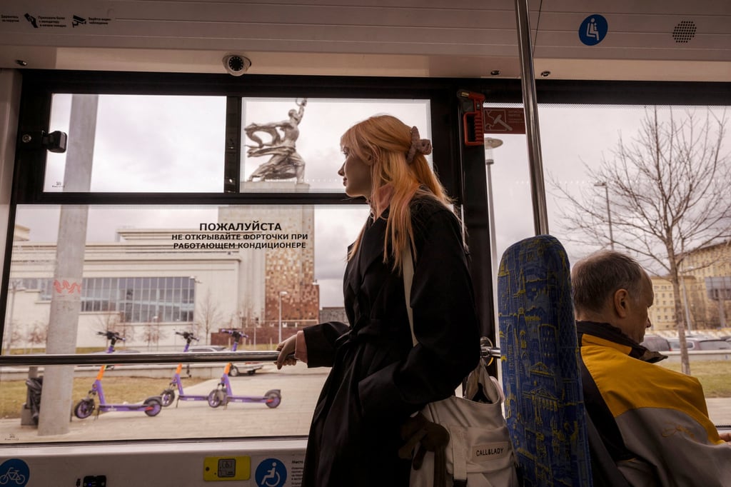 Choreographer Polina Ivanovskaya, 22, looks out of a tram window as she heads to buy fabric for a dancing costume in Moscow, Russia. Photo: Reuters