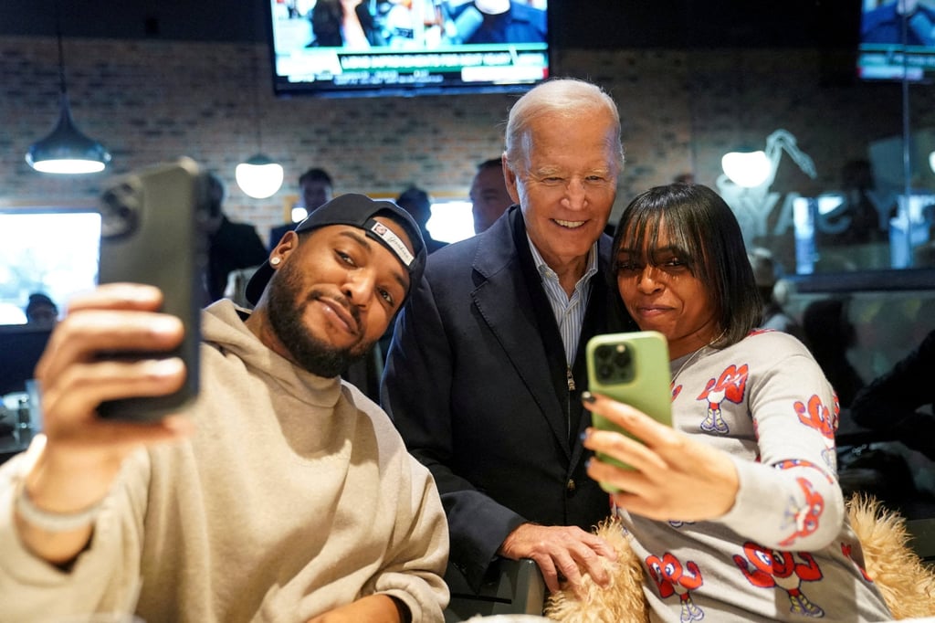 US President Joe Biden poses for selfies in Detroit in February. File photo: Reuters