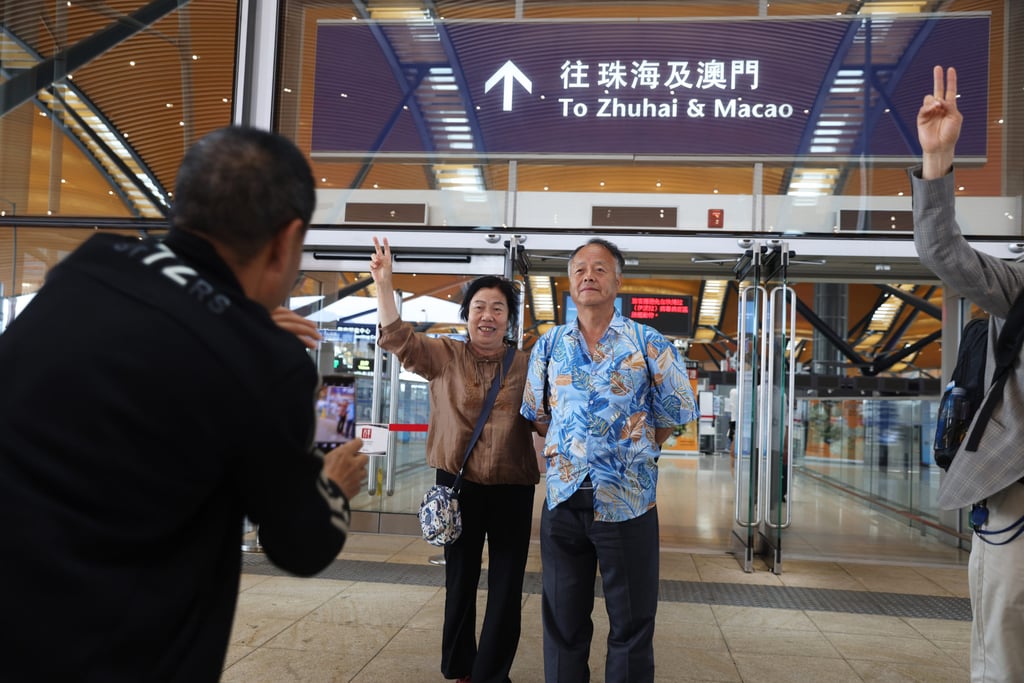 Travellers on their way to Macau at the Hong Kong-Zhuhai-Macau Bridge. Photo: Yik Yeung-man Travellers on their way to Macau at the Hong Kong-Zhuhai-Macau Bridge. Photo: Yik Yeung-man