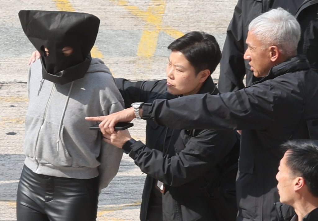 Irene Pun is escorted by police. She allegedly arranged for a yacht to help Choi’s ex-husband flee to Macau. Photo. Yik Yeung-man