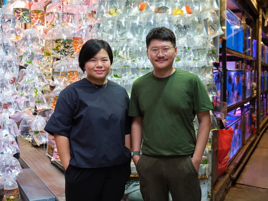 Curator Olivia Chow and Trevor Yeung in a Hong Kong tropical-fish shop. Photo: South Ho Curator Olivia Chow and Trevor Yeung in a Hong Kong tropical-fish shop. Photo: South Ho