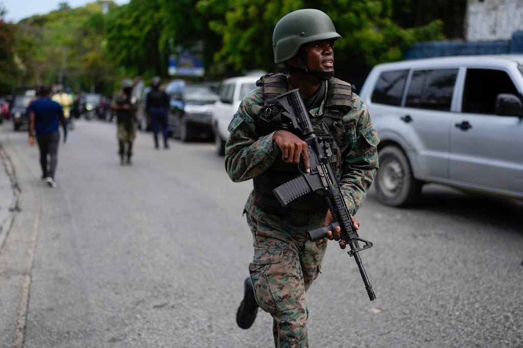 Soldiers deploy outside the Prime Minister’s office in Port-au-Prince. Photo: AP