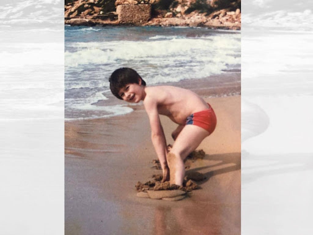 Simon Holliday at the beach as a boy. He learned to swim when he was four. Photo: Simon Holliday