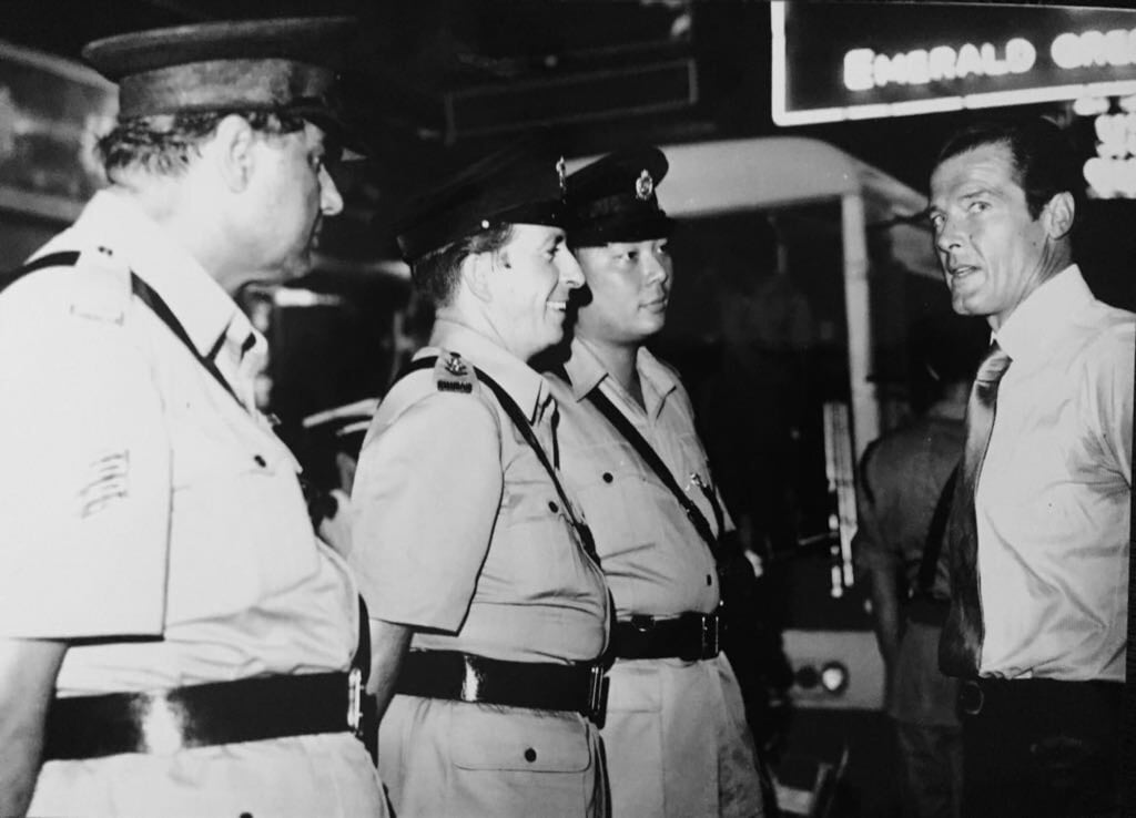 Roger Moore with policemen in Hong Kong, 1974. Photo: SCMP Pictures Roger Moore with policemen in Hong Kong, 1974. Photo: SCMP Pictures