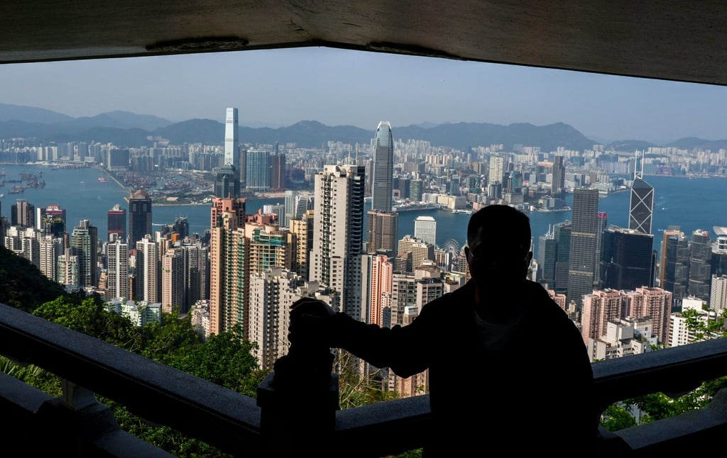 Tourists view the Hong Kong skyline from atop Victoria Peak. There is a need to better promote the city to help rebuild its international reputation. Photo: Eugene Lee Tourists view the Hong Kong skyline from atop Victoria Peak. There is a need to better promote the city to help rebuild its international reputation. Photo: Eugene Lee