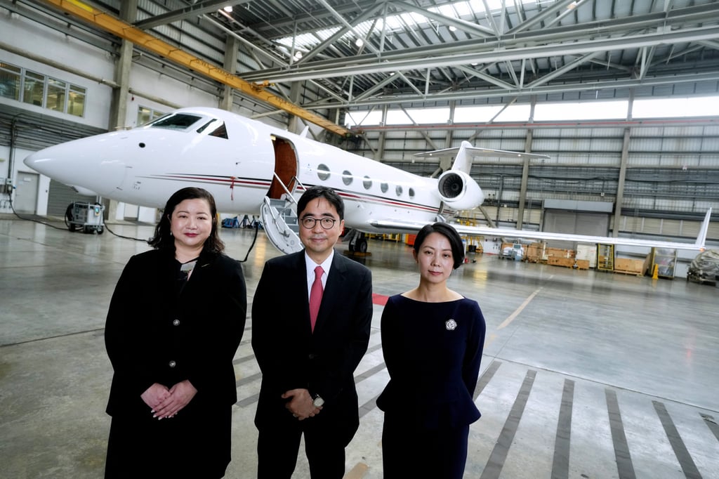 (From left) Deputy general manager Sheree Cheung and chairman Allen Fung of the Hong Kong Business Aviation Centre, stand alongside Amber Aviation vice-president Vicky Tsui. Photo: Elson Li