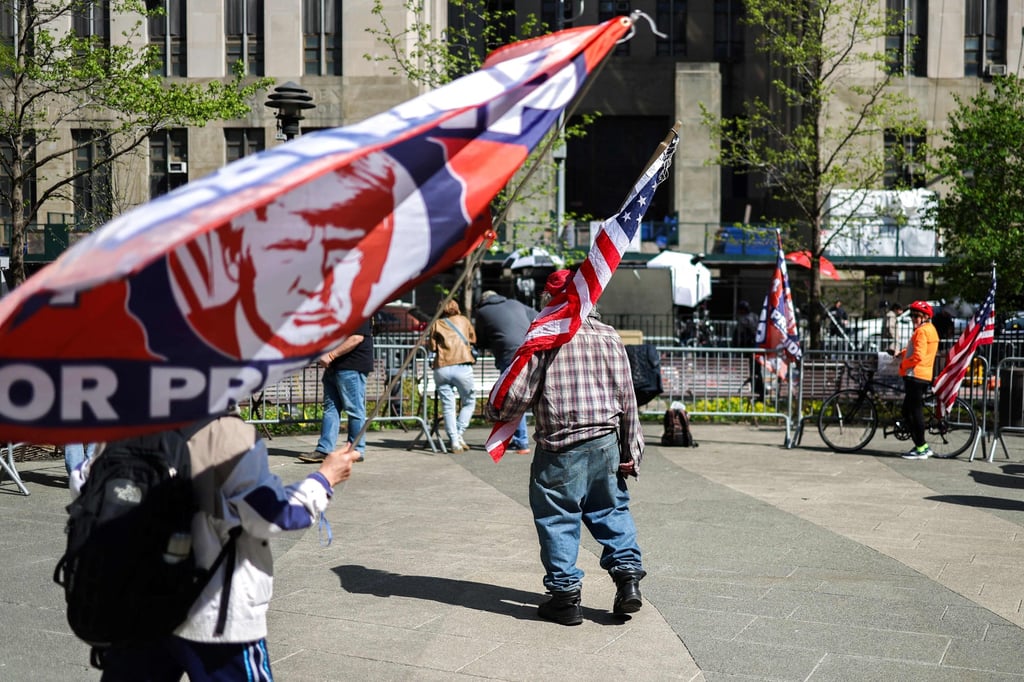 Trump supporters stand outside the federal courthouse in New York on Friday. Photo: AFP Trump supporters stand outside the federal courthouse in New York on Friday. Photo: AFP