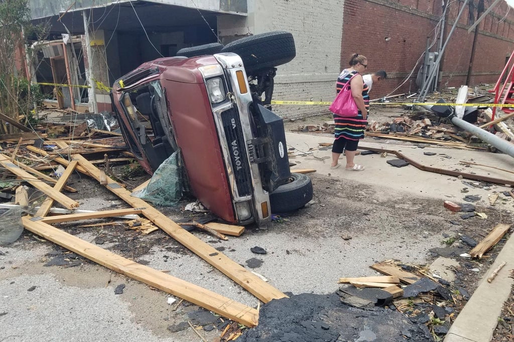 A car lies on its side in Sulphur, Oklahoma. Photo: AP A car lies on its side in Sulphur, Oklahoma. Photo: AP