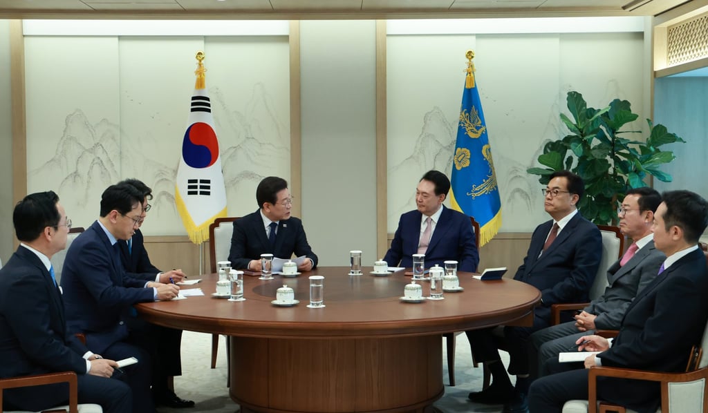 Yoon Suk-yeol (fourth from right) with Lee (fourth from left) amid their discussions in Seoul on Monday. Photo: EPA-EFE/Yonhap