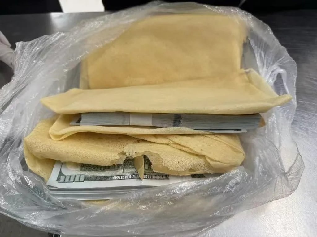 Some of the notes were hidden in bags of flat cake. Photo: SCMP Some of the notes were hidden in bags of flat cake. Photo: SCMP