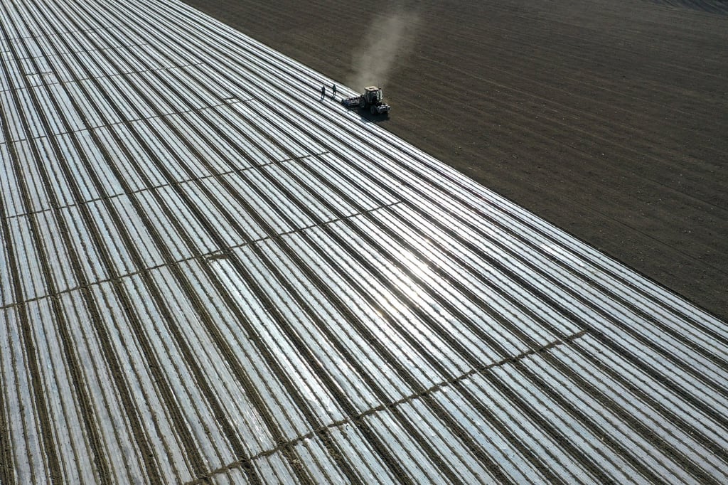 A self-driving cotton seeder works farmland in Awat County of Aksu, in Xinjiang Uygur Autonomous Region, in March. Photo: Xinhua A self-driving cotton seeder works farmland in Awat County of Aksu, in Xinjiang Uygur Autonomous Region, in March. Photo: Xinhua