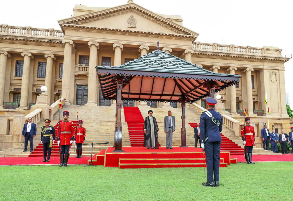 Sri Lankan President Ranil Wickremesinghe (centre right) and Iranian President Ebrahim Raisi (centre left) inspecting the guards of honour at the presidential secretariat in Colombo on April 24. Photo: EPA-EFE/Sri Lankan President’s Media Division