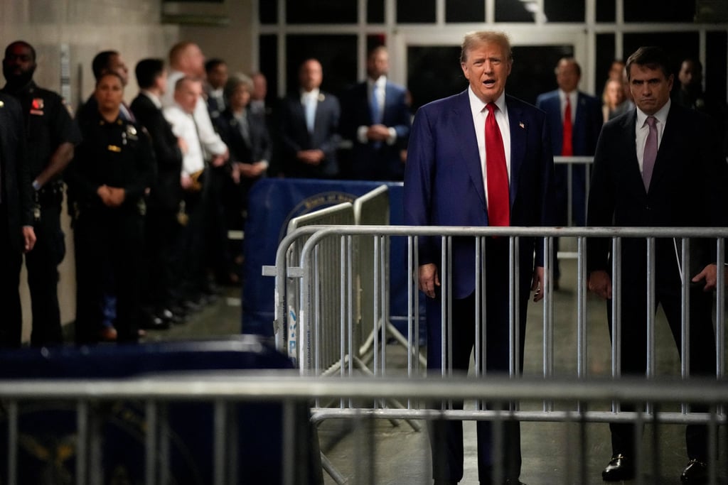 Former president Donald Trump speaks upon arriving at Manhattan criminal court on Tuesday. Photo: Reuters/Pool Former president Donald Trump speaks upon arriving at Manhattan criminal court on Tuesday. Photo: Reuters/Pool