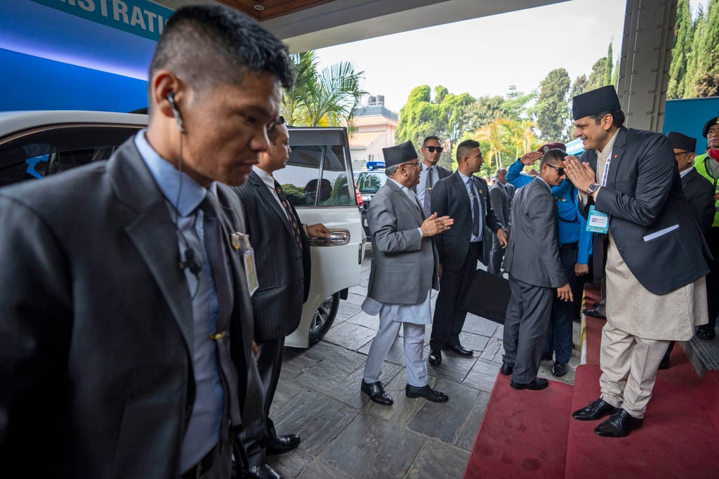 Nepal’s Prime Minister Pushpa Kamal Dahal (centre) arrives to inaugurate the Nepal Investment Summit in Kathmandu. Photo: AP Nepal’s Prime Minister Pushpa Kamal Dahal (centre) arrives to inaugurate the Nepal Investment Summit in Kathmandu. Photo: AP
