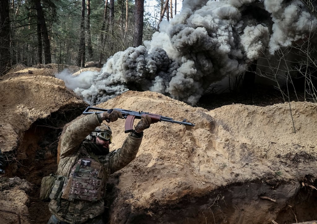 A Ukrainian serviceman takes part in radiation, chemical and biological hazard drills Kharkiv in February. Photo: Reuters