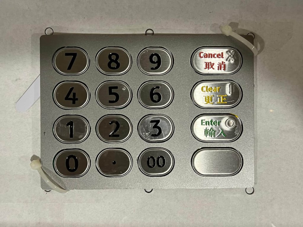 The false keypad found on the machine. The devices were first spotted a bank employee. Photo: Hong Kong Police The false keypad found on the machine. The devices were first spotted a bank employee. Photo: Hong Kong Police
