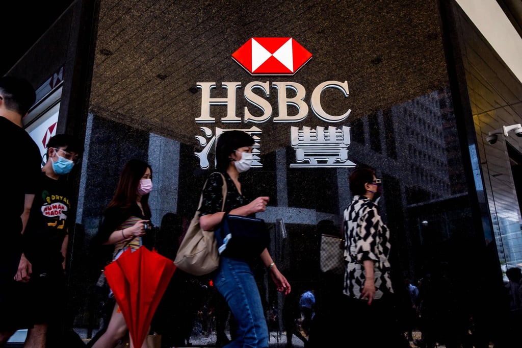 Pedestrians walk past the logo for HSBC outside a local branch bank in Hong Kong. Photo: AFP Pedestrians walk past the logo for HSBC outside a local branch bank in Hong Kong. Photo: AFP