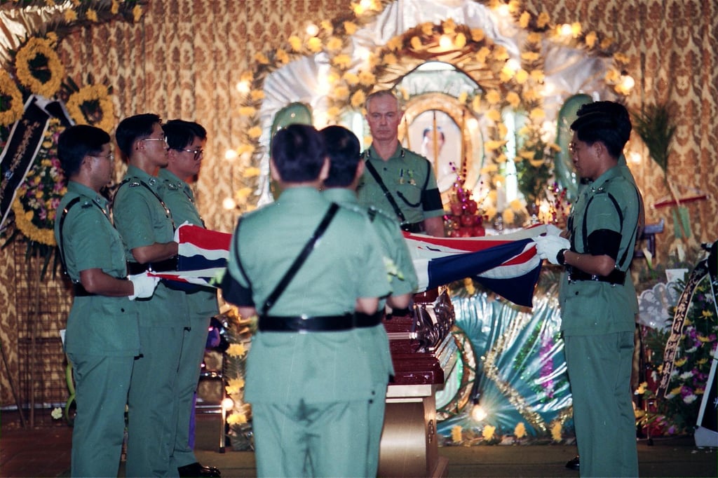 Police officers wear black armbands at the funeral service for Chief Inspector Leung Chi-lung, who was shot at his desk at Castle Peak police station, Hong Kong, by Sergeant Leung Chung in 1994. Photo: SCMP