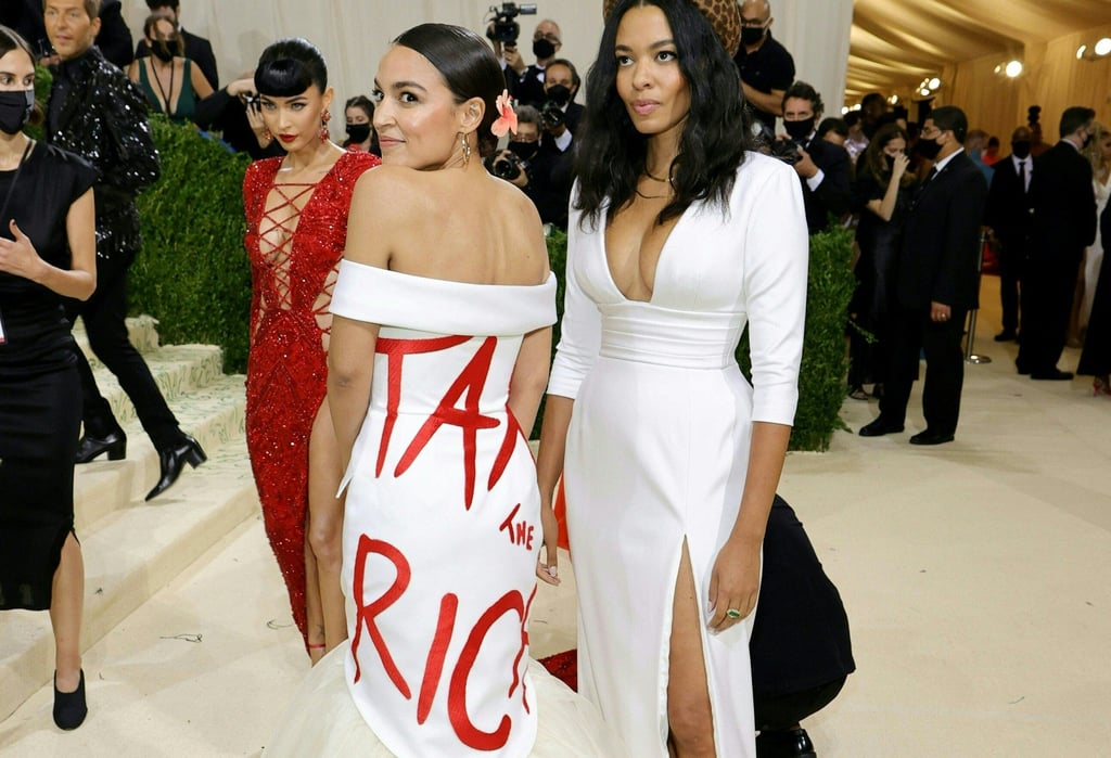 Alexandria Ocasio-Cortez in “that” dress with Aurora James at The 2021 Met Gala in New York. Photo: Getty Images North America/AFP