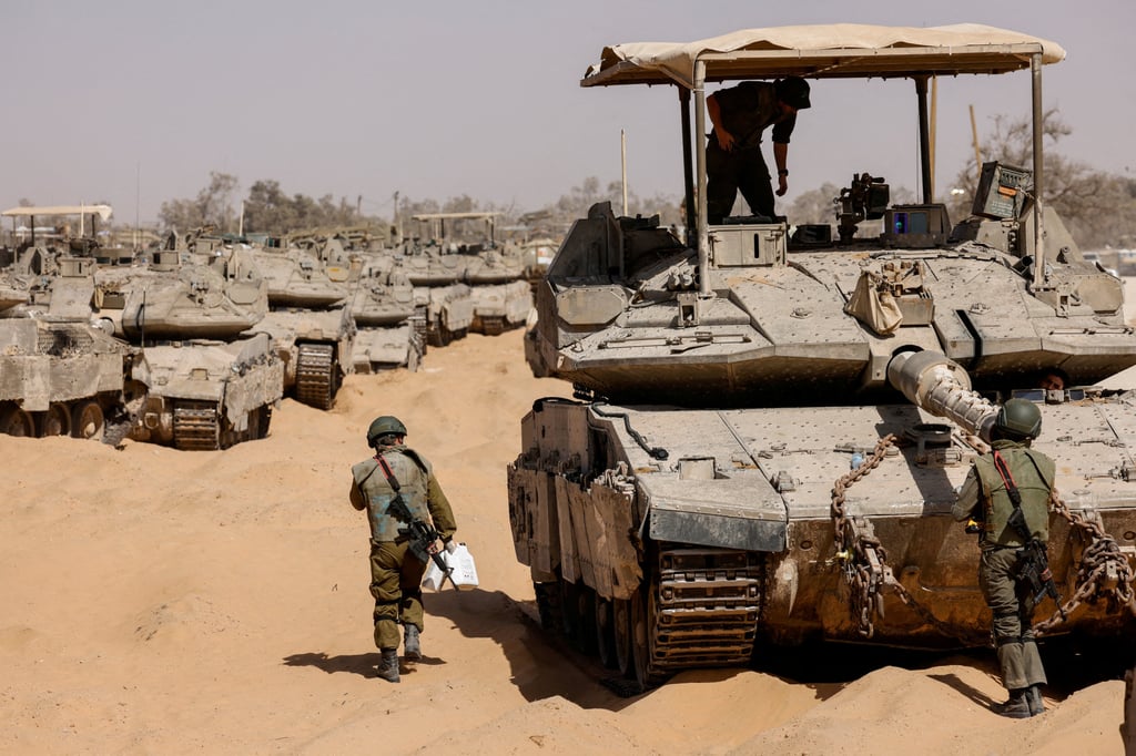 Israeli soldiers and tanks near the Israel-Gaza border, in southern Israel. Photo: Reuters