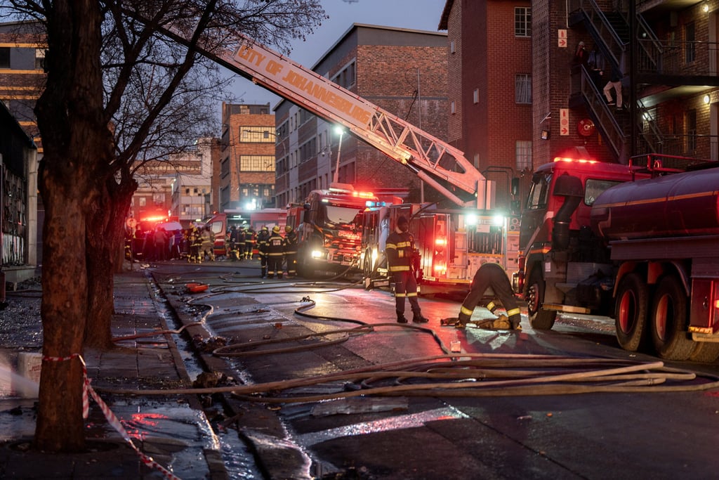 Firefighters work at the scene of a deadly blaze in the early hours of the morning, in Johannesburg, South Africa on August 31, 2023. Photo: Reuters Firefighters work at the scene of a deadly blaze in the early hours of the morning, in Johannesburg, South Africa on August 31, 2023. Photo: Reuters