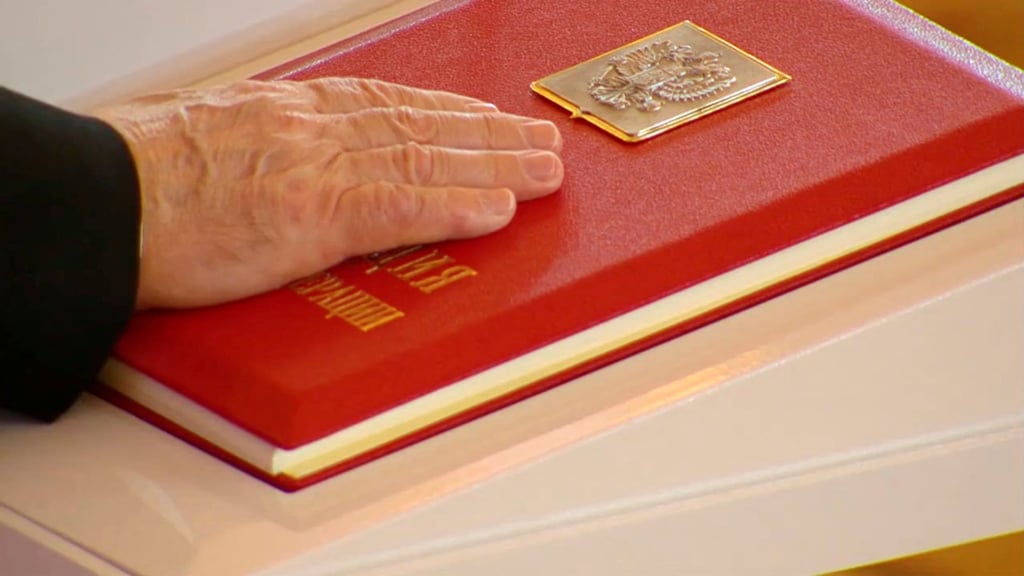 Russian President Vladimir Putin places his hand on the Constitution as he takes the oath during an inauguration ceremony at the Kremlin in Moscow, Russia on Tuesday. Photo: Kremlin.ru/Handout via Reuters Russian President Vladimir Putin places his hand on the Constitution as he takes the oath during an inauguration ceremony at the Kremlin in Moscow, Russia on Tuesday. Photo: Kremlin.ru/Handout via Reuters