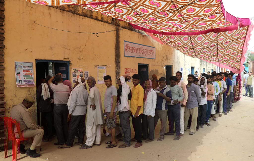 Indian voters queue to cast their votes at a polling station in Uttar Pradesh on Tuesday. Photo: EPA-EFE