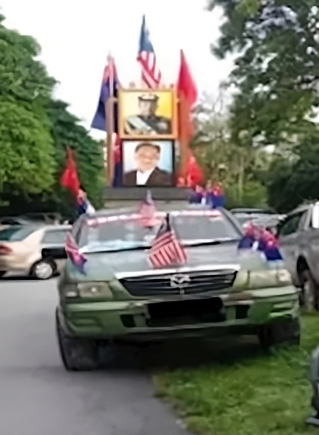 A low-resolution image provided by police of the car involved in the case, featuring images of Malaysia’s king and prime minister. Photo: Facebook/PolisDaerahHuluSelangor
