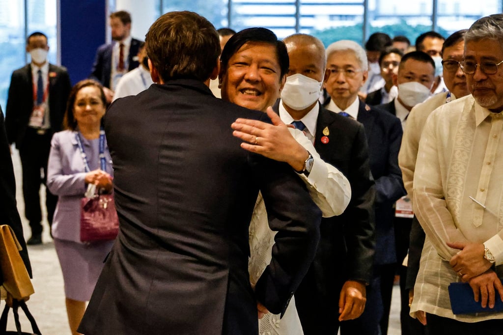 Philippine President Ferdinand Marcos Jnr (centre) hugs French President Emmanuel Macron on the sidelines of an Apec summit in 2022. Manila is exploring the possibility of a visiting-forces agreement with France. Photo: AFP Philippine President Ferdinand Marcos Jnr (centre) hugs French President Emmanuel Macron on the sidelines of an Apec summit in 2022. Manila is exploring the possibility of a visiting-forces agreement with France. Photo: AFP