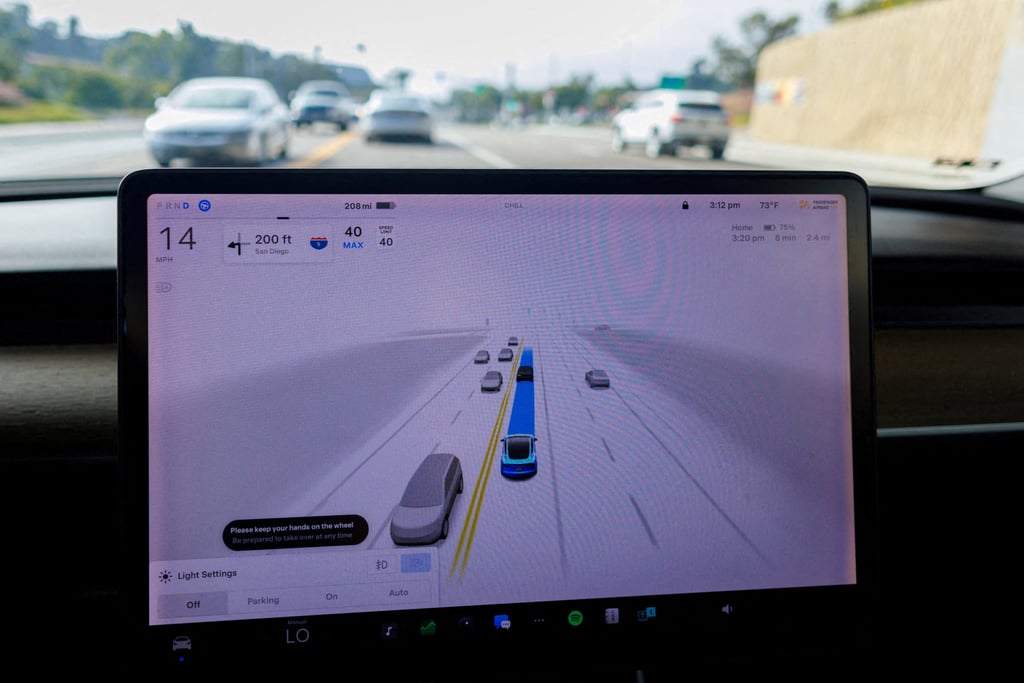 A Tesla Model 3 vehicle warns the driver to keep hands on the wheel when the carmaker’s Autopilot feature and Full Self-Driving system are engaged in a test run at Encinitas, California, on October 18, 2023. Photo: Reuters A Tesla Model 3 vehicle warns the driver to keep hands on the wheel when the carmaker’s Autopilot feature and Full Self-Driving system are engaged in a test run at Encinitas, California, on October 18, 2023. Photo: Reuters