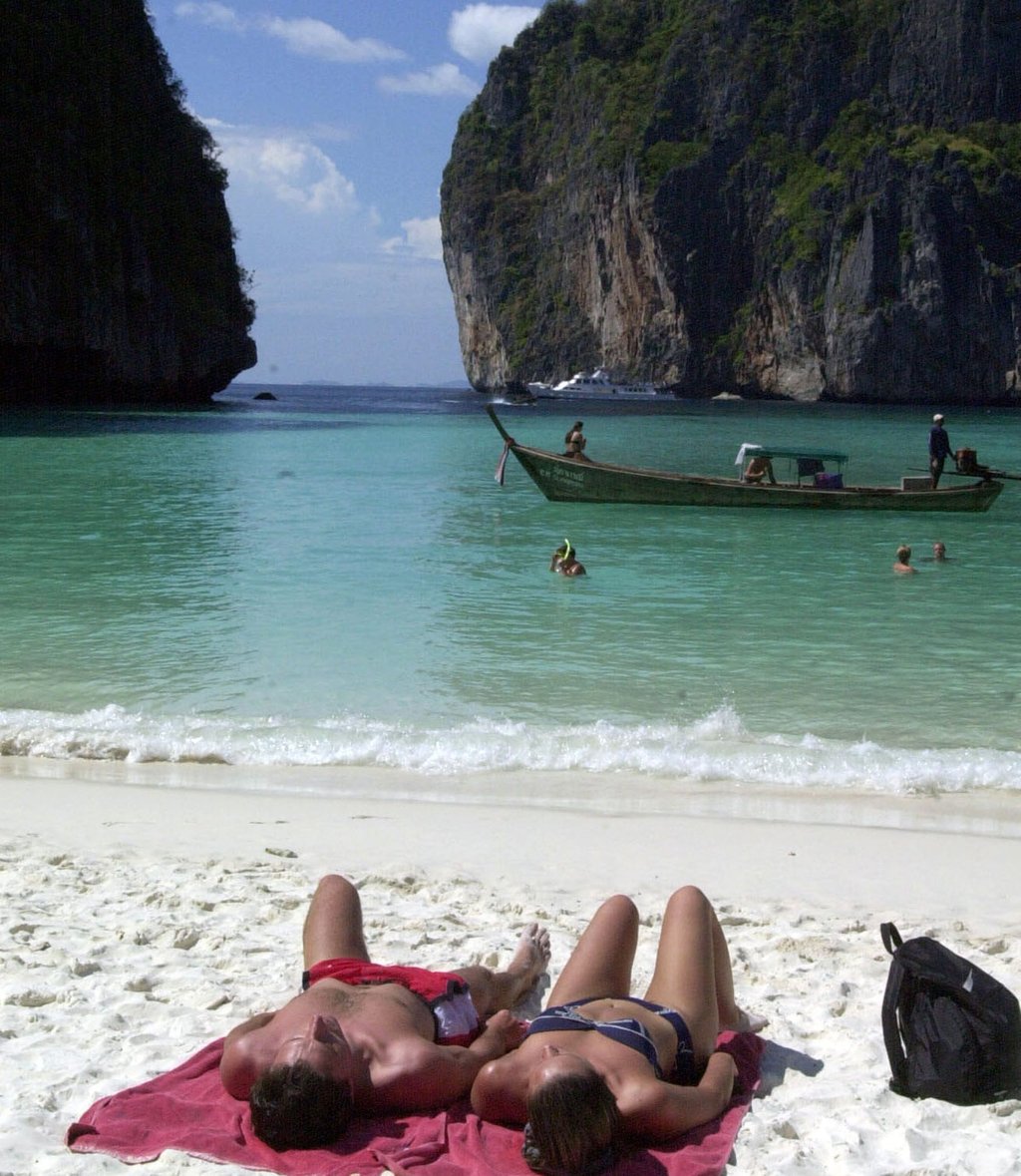 Tourists catch the sun’s rays on remote Maya Beach in southern Thailand, now made famous as the shooting location of the Leonardo DiCaprio film, “The Beach”. Photo: Reuters Tourists catch the sun’s rays on remote Maya Beach in southern Thailand, now made famous as the shooting location of the Leonardo DiCaprio film, “The Beach”. Photo: Reuters