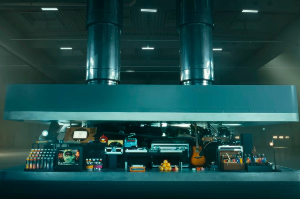 In this image taken from the iPad video ad, a hydraulic press crushes an array of creative instruments. Photo: Apple via AP