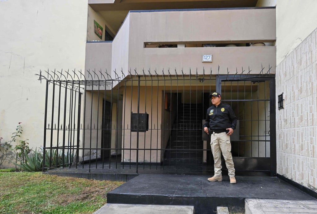 A police officer stands guard as a search is conducted at the home of Nicanor Boluarte, brother of Peruvian President Dina Boluarte, in Lima on Friday. Photo: AFP A police officer stands guard as a search is conducted at the home of Nicanor Boluarte, brother of Peruvian President Dina Boluarte, in Lima on Friday. Photo: AFP