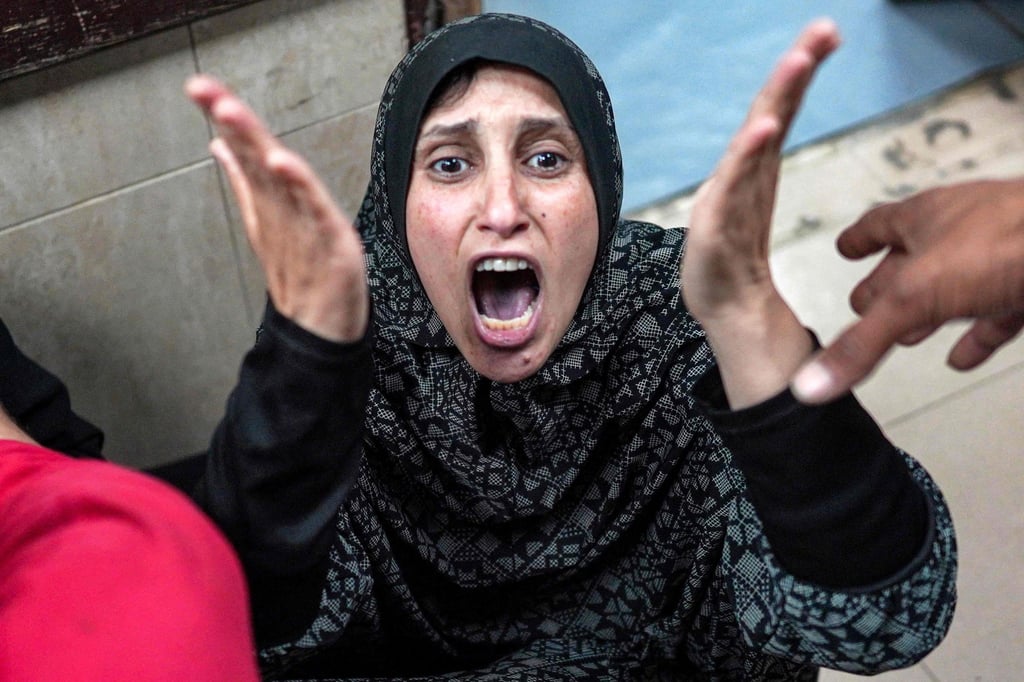 A woman reacts outside a trauma ward at the Aqsa Martyrs Hospital in Deir el-Balah after a child relative died. Photo: AFP A woman reacts outside a trauma ward at the Aqsa Martyrs Hospital in Deir el-Balah after a child relative died. Photo: AFP