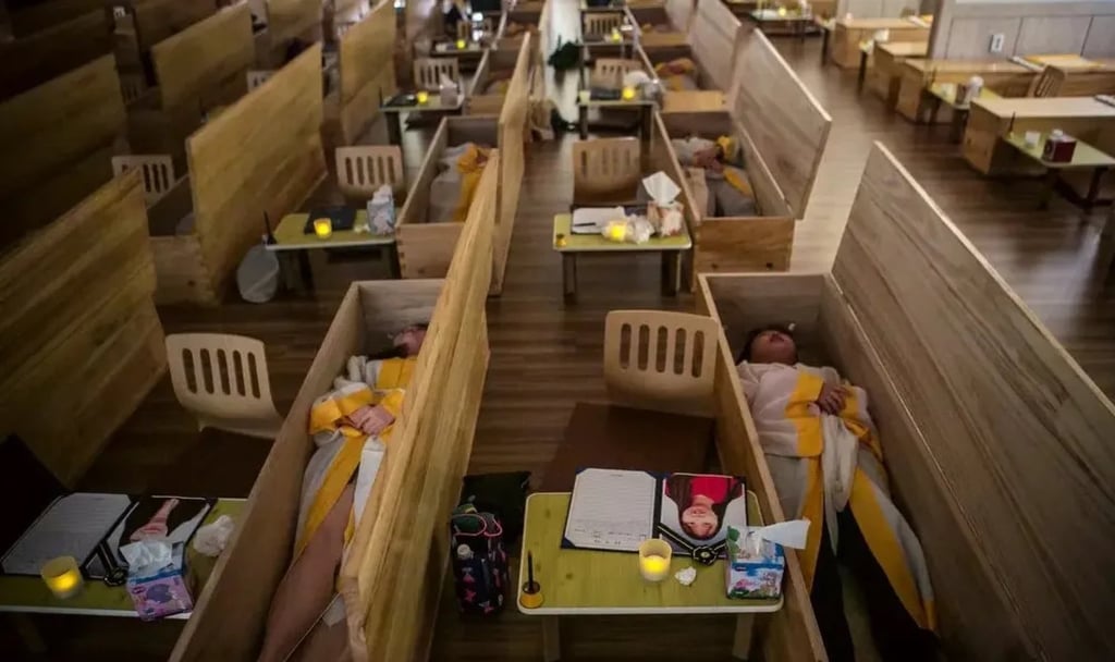 Other strange ways of combating stress in overworked South Korea include sleeping in “coffins”. Photo: Weixin Other strange ways of combating stress in overworked South Korea include sleeping in “coffins”. Photo: Weixin