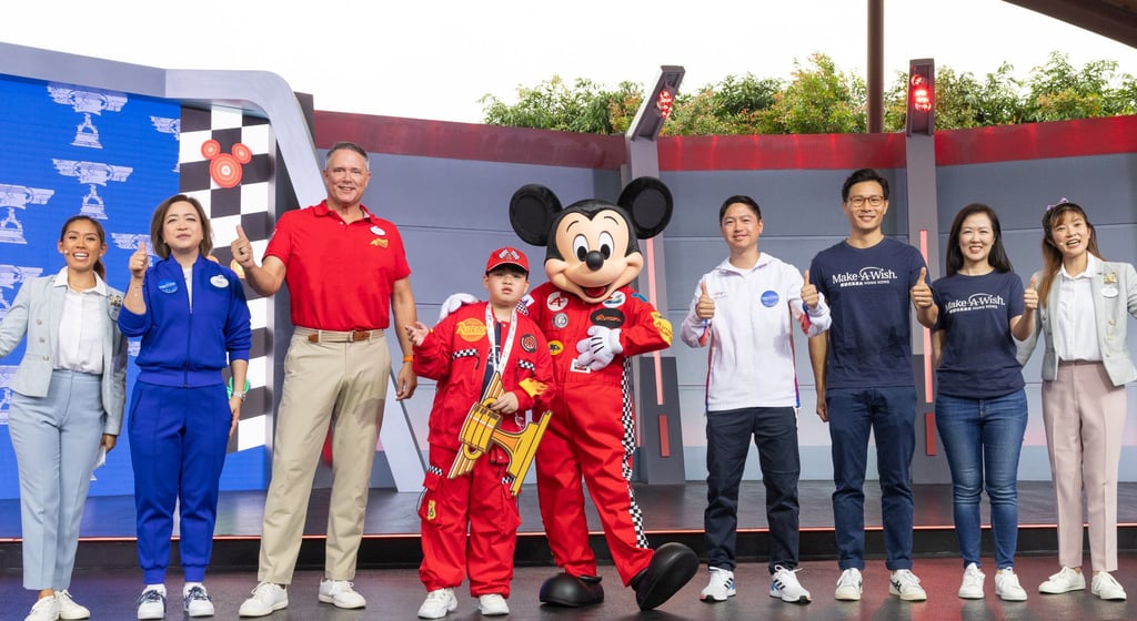 Michael Moriarty (third from left), managing director of Hong Kong Disneyland Resort, also took part in the World Wish Day event at the theme park and saw Leong’s wish get granted.